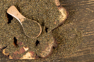 dried tea leaves, ground and crumbled into very small pieces with the addition, a Photo by rsoollAI