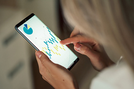 Woman working with graph on a device