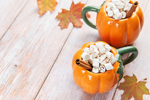 Pumpkin shaped mugs with hot chocolate and marshmallows, a Food & Drink Photo by Olena Rudo