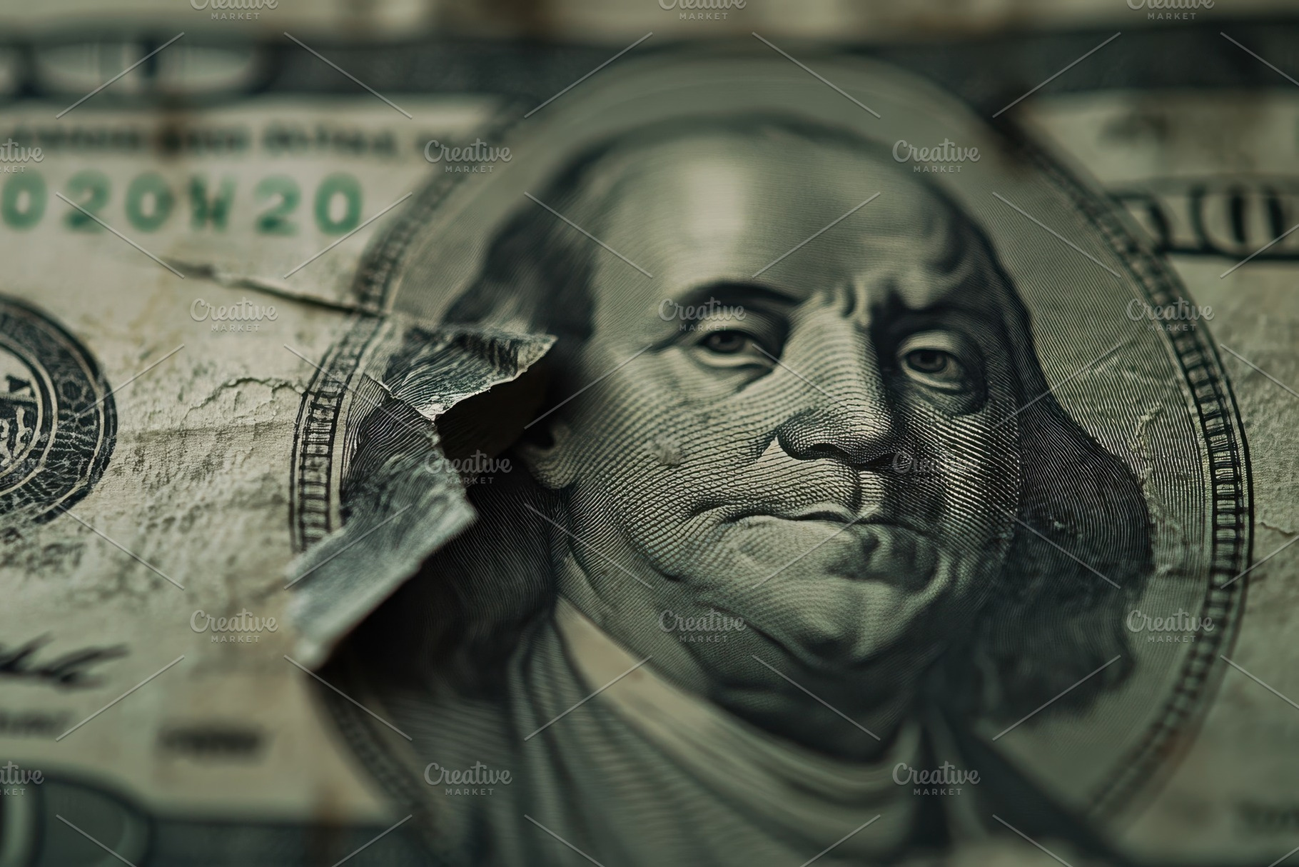 Closeup view of a torn dollar, a Photo by Pavel_design