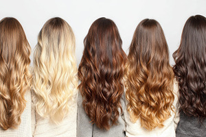 Women with various hair colors stand, a Photo by Pavel_design