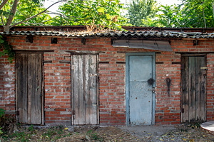 Four doors on wall of storage shed, an Architecture Photo by Schreibikus