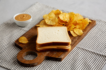 Homemade American Peanut Butter Sandwich on a Wooden Board, side