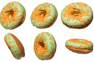 Green glazed donuts, each topped with orange sprinkles, presente, a Food & Drink Photo by ndanko