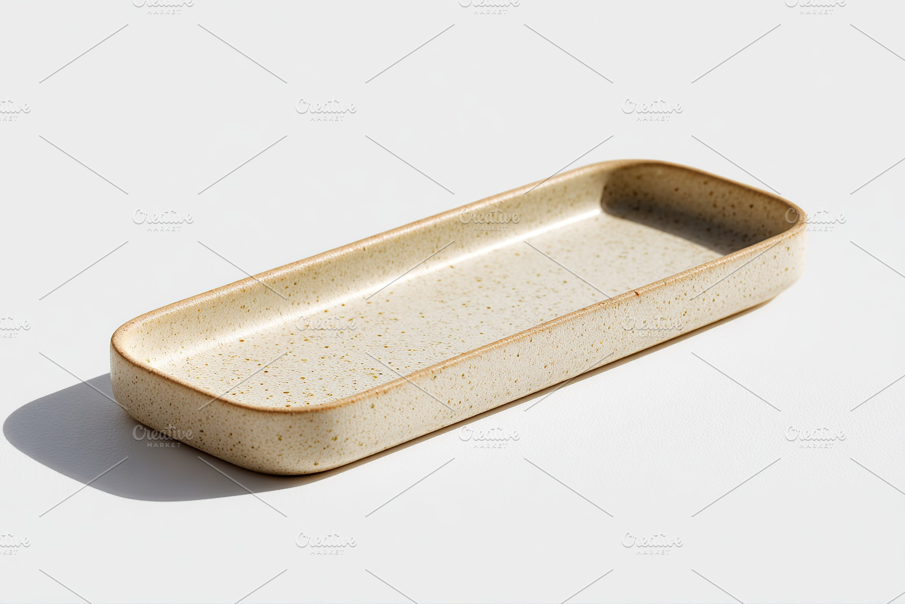 Rectangular ceramic plate in light beige color with speckled pattern for servin, a Food & Drink Photo by AlyaAnd