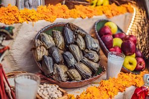Wrapped tamales among fruit and