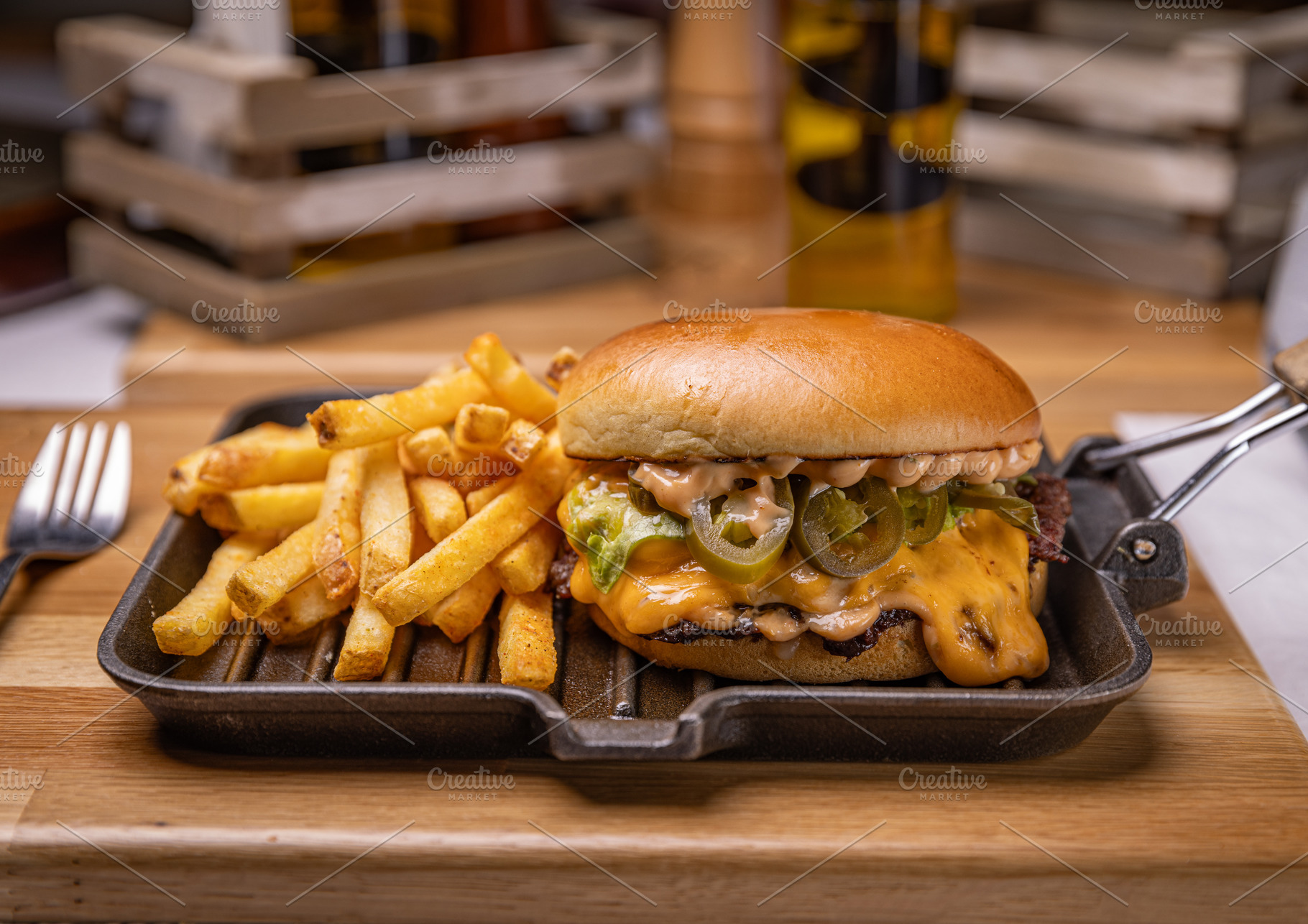 Delicious cheeseburger with french fries, a Photo by Grafvision photography