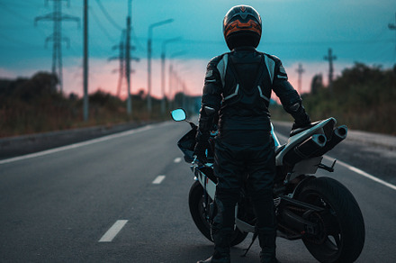 Biker on a powerful sports motorcycle . The road to the sunset., a Transportation Photo by PavelKant