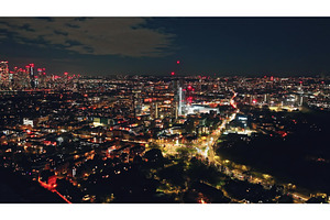 London glowing at night seen from a, an Architecture Photo by Goinyk