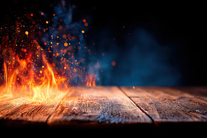 Wooden tabletop with glowing sparks on dark background, a Background Photo by AlyaAnd