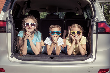 Happy kids sitting in the car stock photo containing car and child