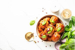 Meatballs in tomato sauce on white, a Food & Drink Photo by Nadia-nb