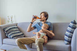 Stressed father sitting on couch, a Person Photo by Elizaveta Galitskaya