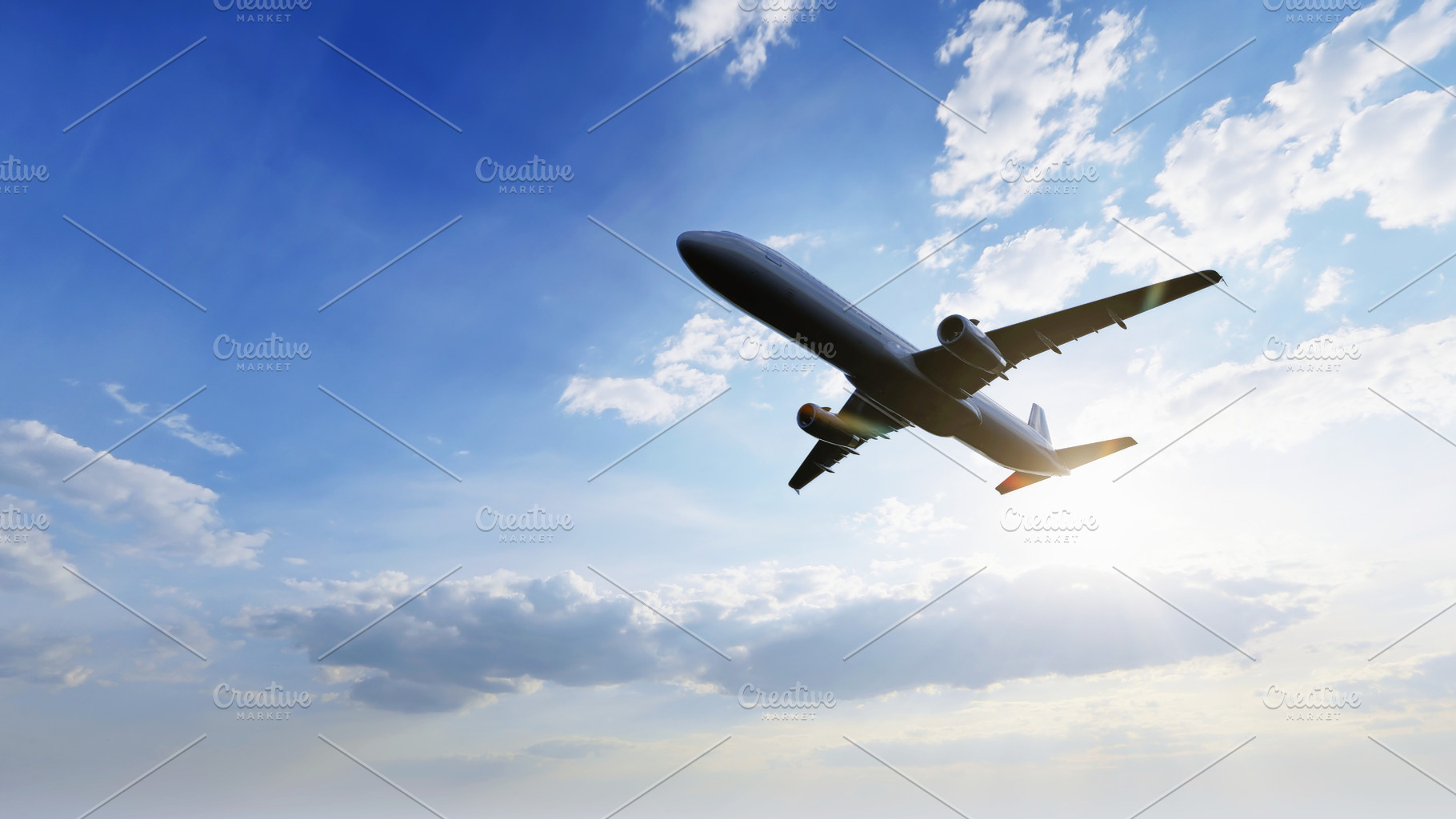Airplane flying in the air with sunlight shining in blue sky background. Travel, a Transportation Photo by Ministocker