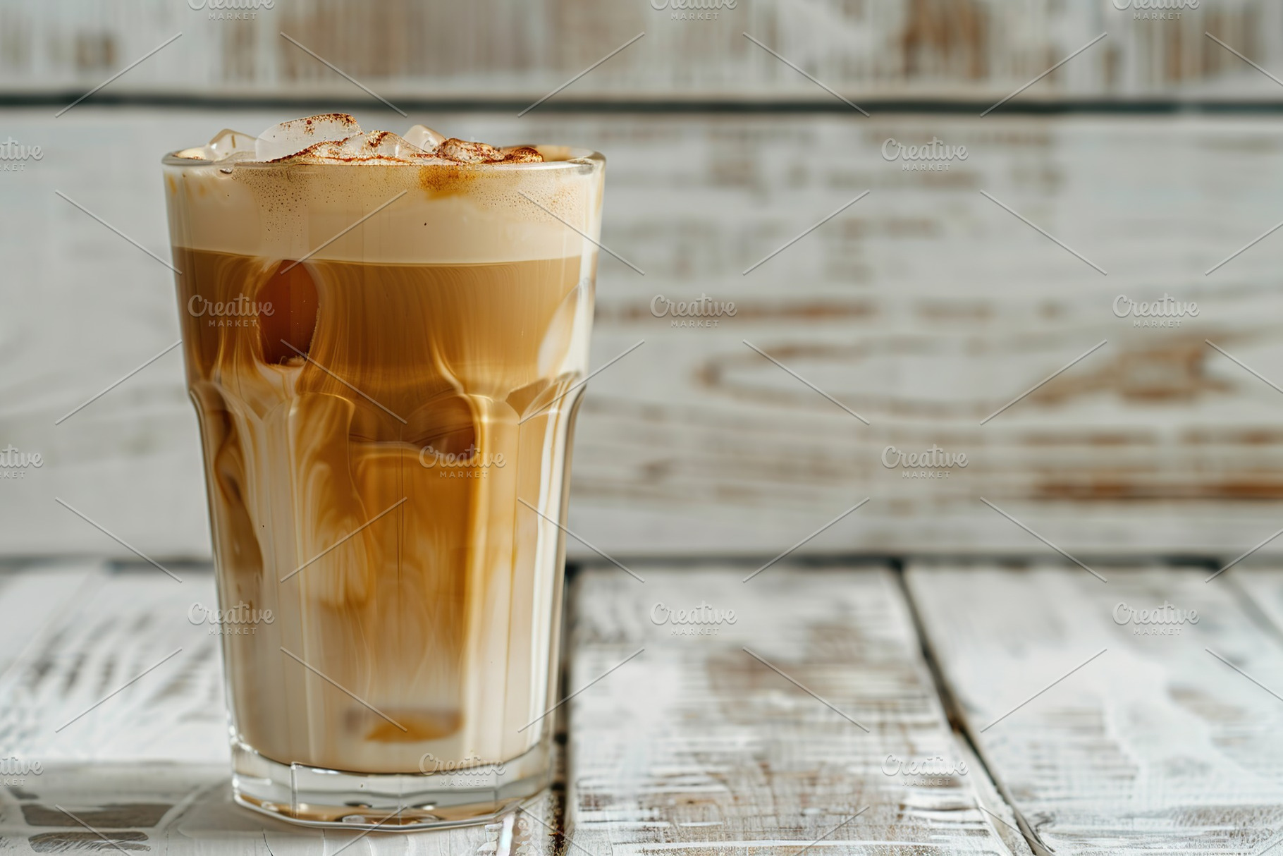 Glass of iced coffee on wooden table, a Food & Drink Photo by AlyaAnd