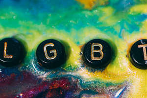 Lgbt word glitter ink splatter letter tolerance, a Background Photo by Photo Drive Studio