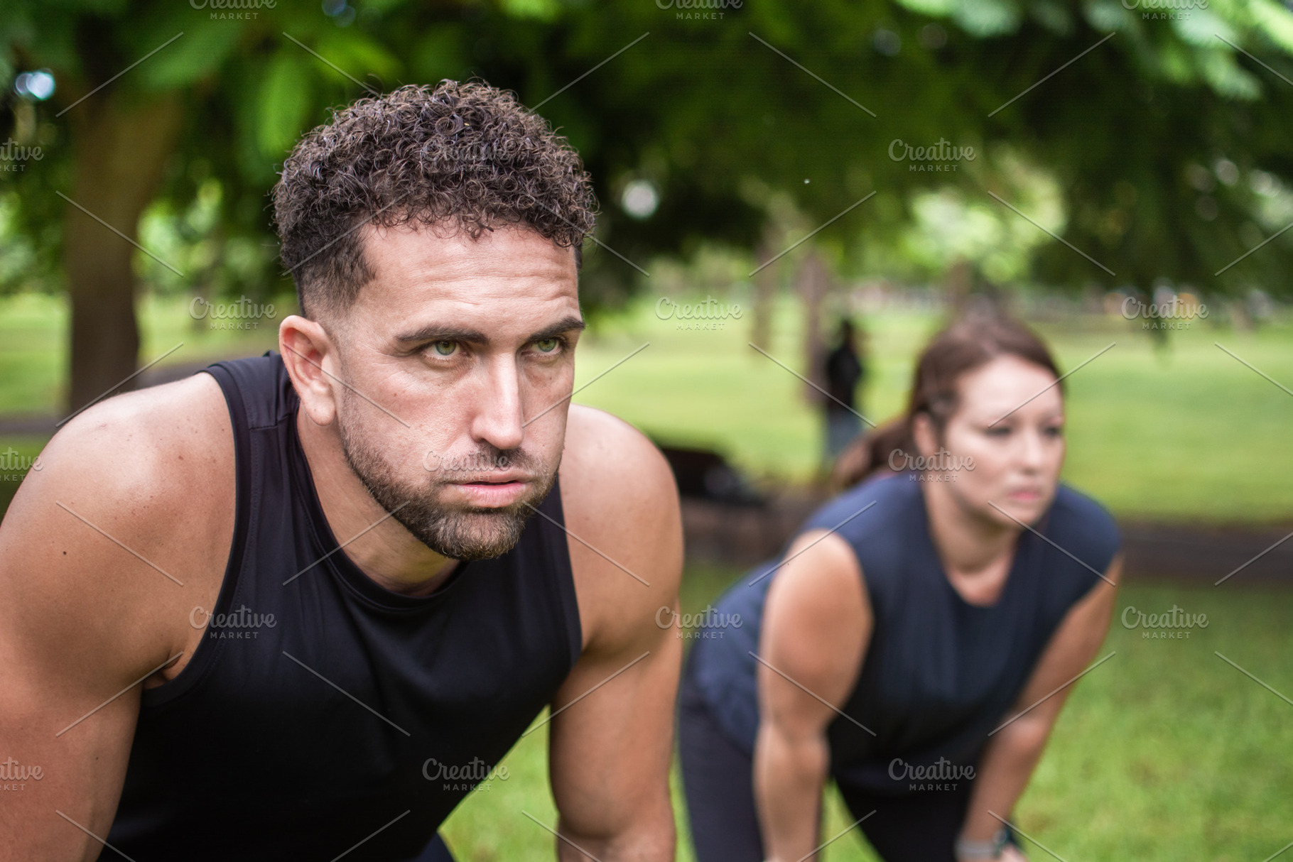 Tired man and woman resting after outdoor fitness workout in park, a Photo by etorres69