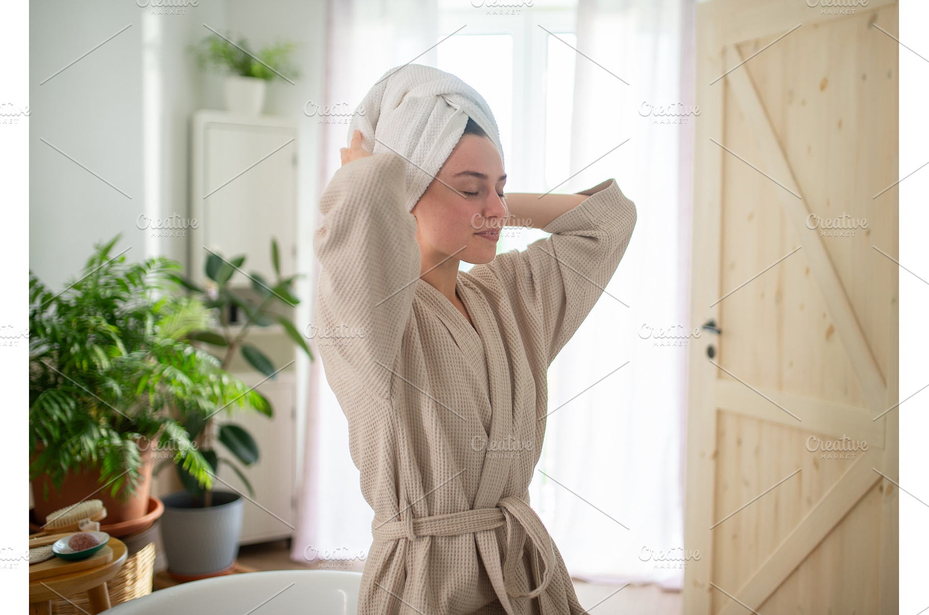 young woman enjoying hair care, a Person Photo by HalfPoint