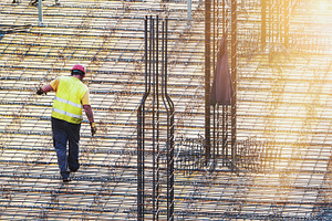 Worker at construction site, an Industrial Photo by BOOCYS