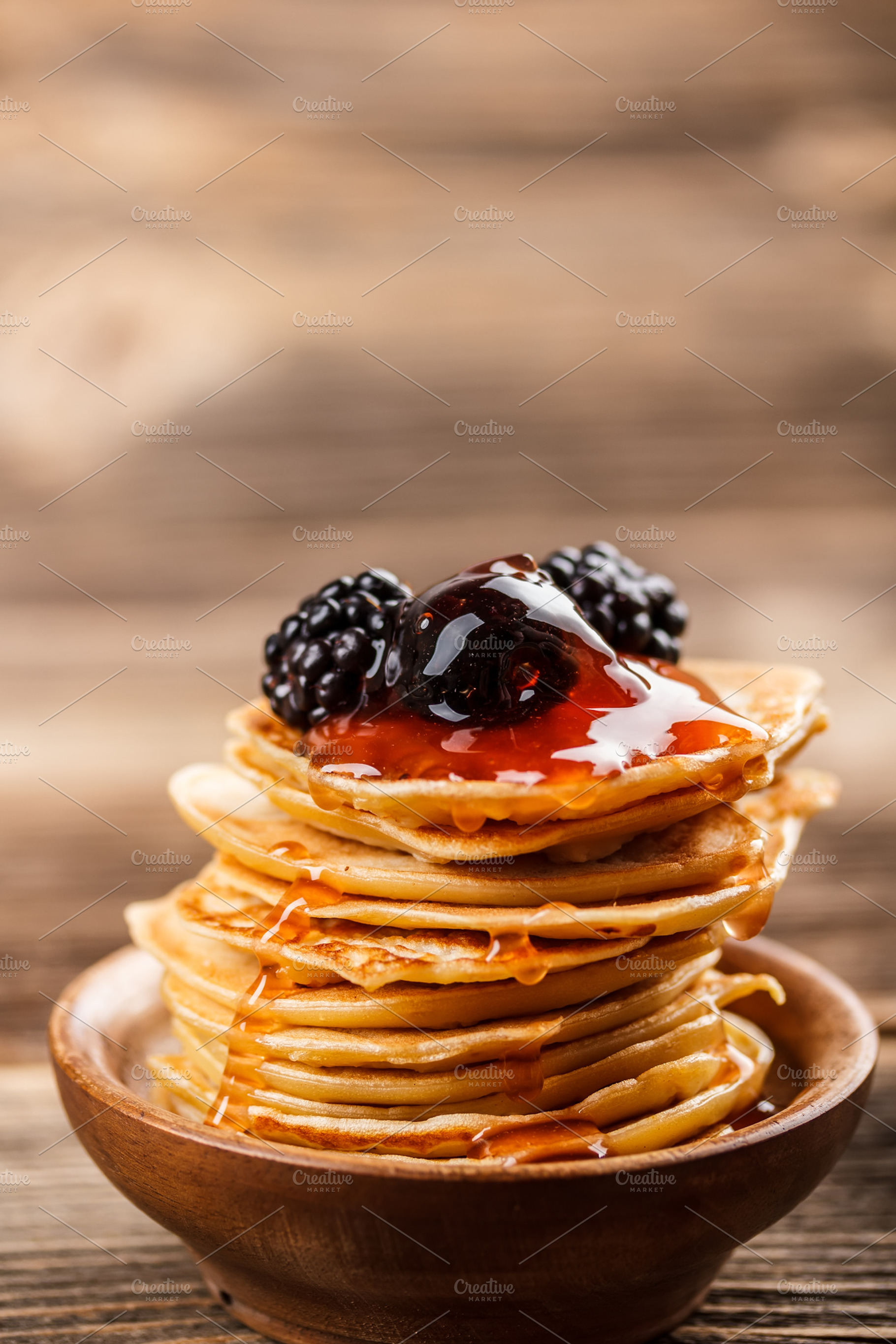 Mini pancakes featuring berry, desert, and blackberry