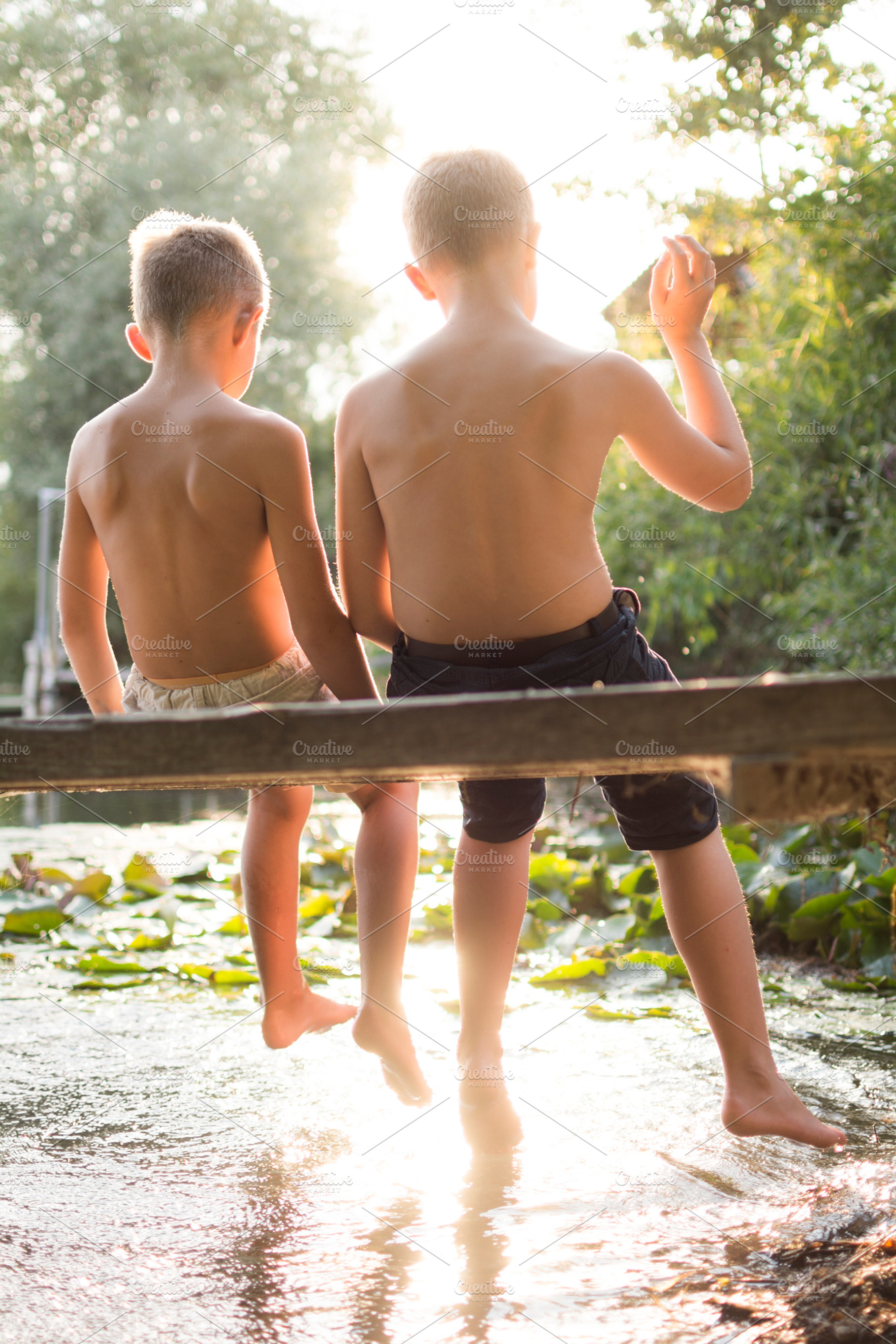 Summer vacation friends at the lake featuring kid, childhood, and reflections, a Person Photo by Twin Design