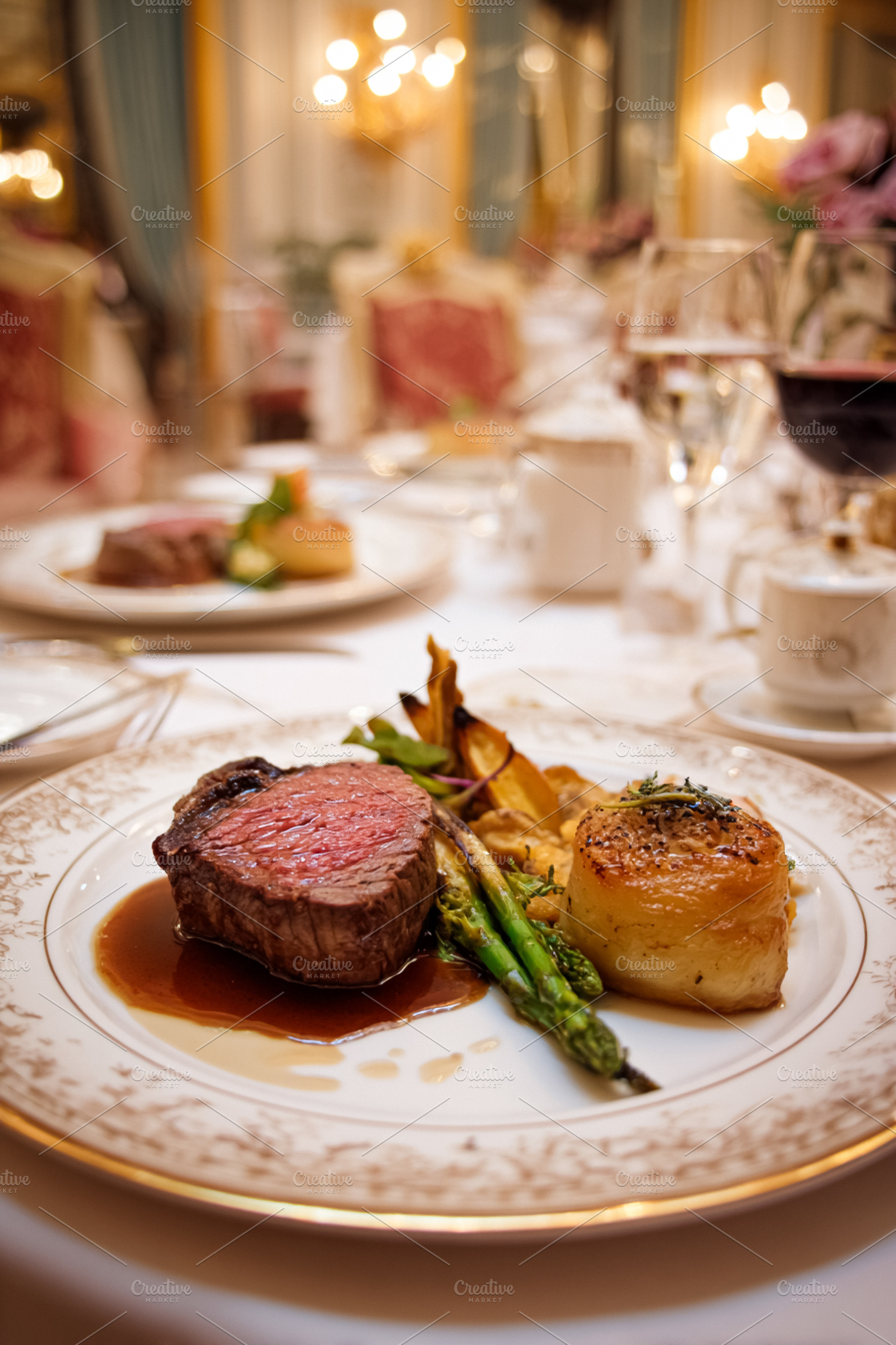 Gourmet steak dinner plated with asparagus and potato gratin in, a Food & Drink Photo by Studio ANNA