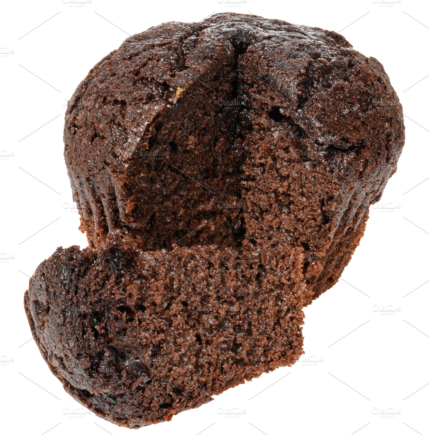 A partially cut dark chocolate muffin or cupcake, revealing its, a Food & Drink Photo by ndanko