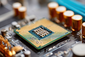 Close-up of a computer processor on a motherboard, a Technology Photo by AlyaAnd