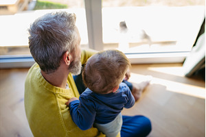 Father with little toddler son, a Person Photo by HalfPoint