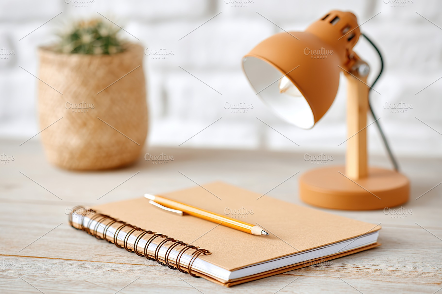 Workspace featuring an analog notepad and e-ink technology next to a stylish la, a Photo by AlyaAnd