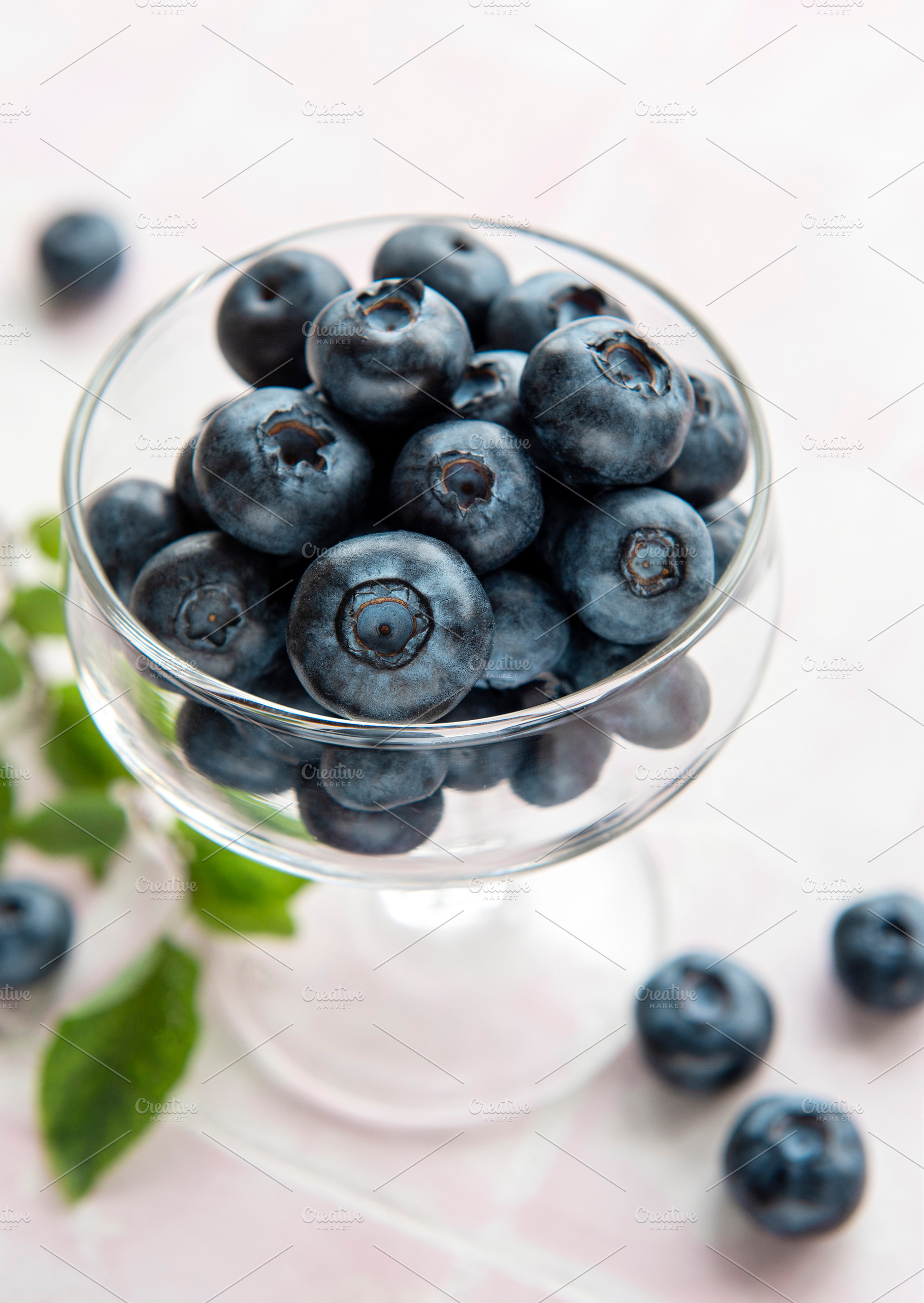 Blueberries on tile background, a Food & Drink Photo by Olena Rudo