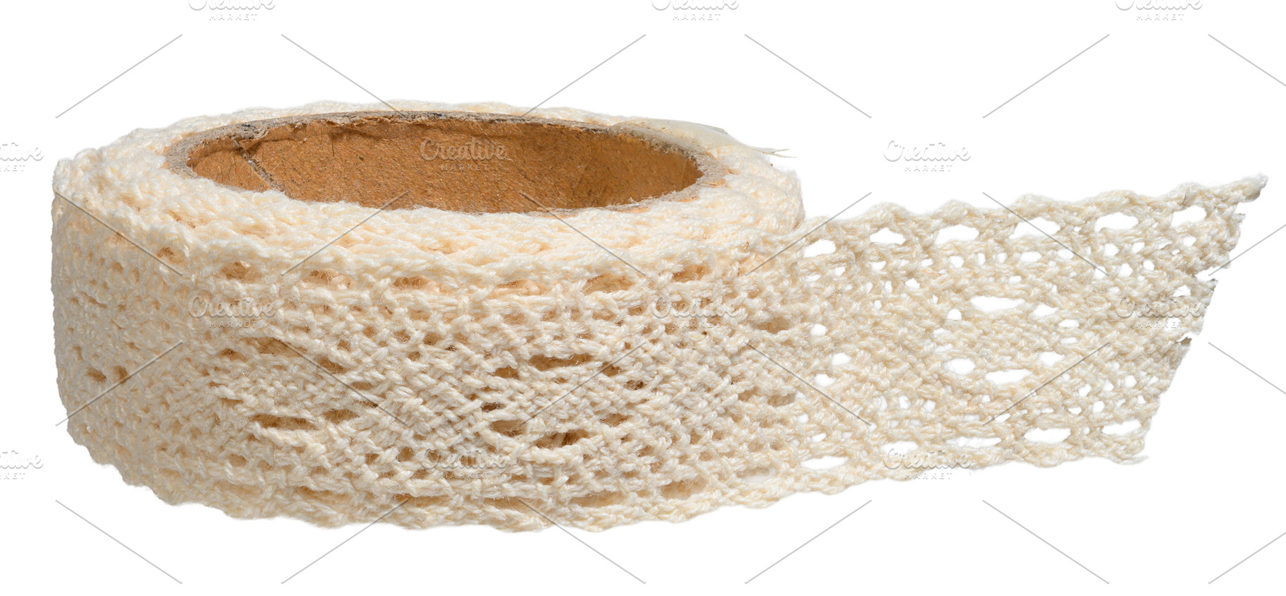 Close-up of beige knitted ribbon with lace pattern rolled into a, a Beauty & Fashion Photo by ndanko