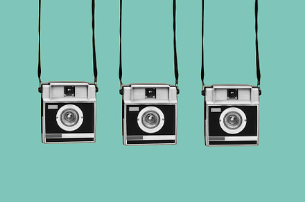 retro film cameras on a blue background, a Photo by Nito