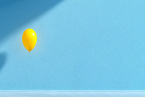 Single yellow balloon floating in minimalist blue room with dram, a Holiday Photo by José Manuel Gelpi