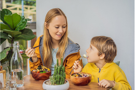 Mother and son eating Raw Organic, a Food & Drink Photo by Elizaveta Galitskaya