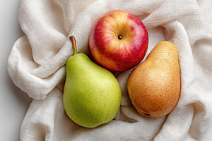 Seasonal assortment of fresh apples and pears arranged on a soft textile backdr, a Food & Drink Photo by AlyaAnd