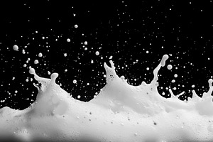 Dramatic white foam splashes against, a Photo by Tanuart