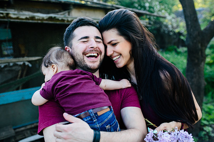 Young family with a child on the nature stock photo containing child and fun, a Person Photo by Tekso