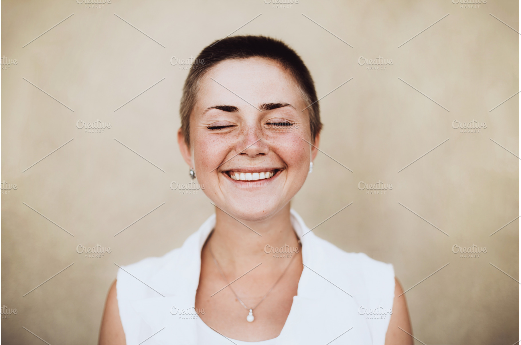 Woman with buzz cut finding joy and, a Person Photo by Anna Efetova