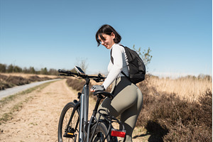 Free-spirited woman with backpack, a Sports & Recreation Photo by AD Stock Images