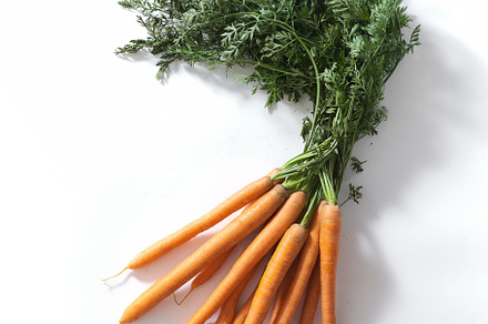 Flatlay with a bunch of fresh carrots with tops, a Food & Drink Photo by Asya Nurullina