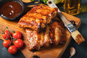 Spicy hot grilled spare ribs from a summer BBQ served with a hot chili pepper a, a Food & Drink Photo by Budarinphoto