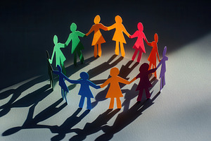 Colorful paper cut figures standing, a Photo by Pavel_design