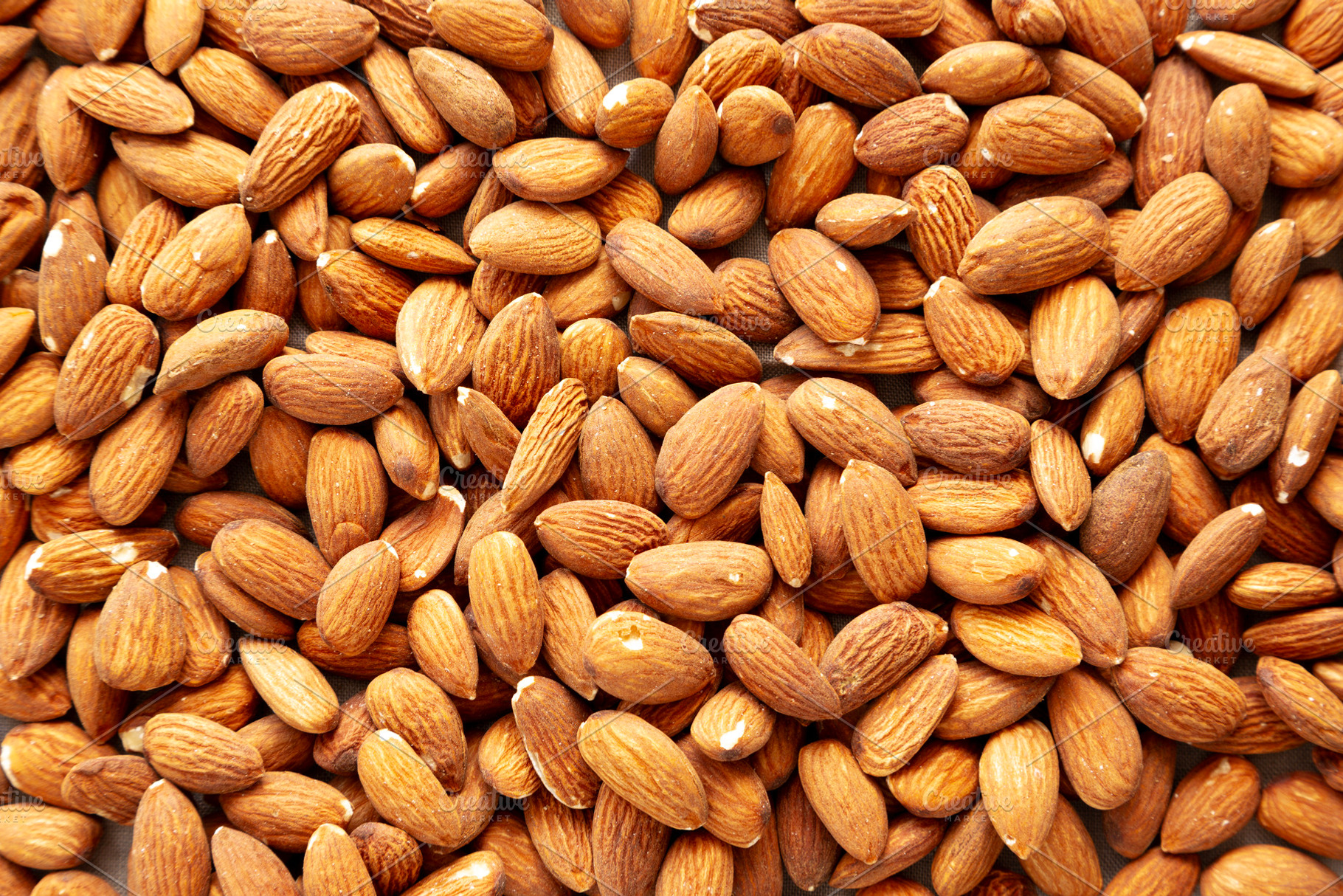 Roasted Almonds, top view. Flat lay, overhead, from above., a Food & Drink Photo by LiudmylaChuhunova
