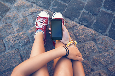 teenager sitting with mobile phone i, a Person Photo by SZ IMAGE