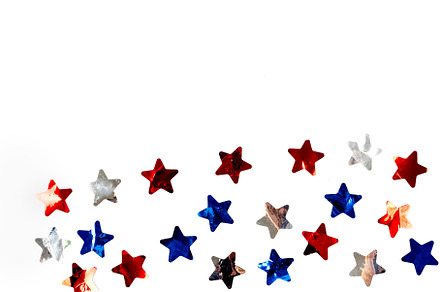 red, white and blue star-shaped confetti on white background, a Holiday Photo by vimart