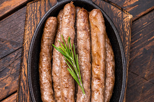Delicious grilled sausage served with fresh herbs, a mouthwateri, a Food & Drink Photo by composter-box@mail.ru