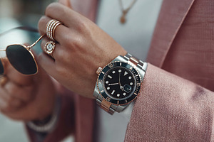 Influencer man showcases luxury watch and accessories in city setting, a Person Photo by OSORIOartist