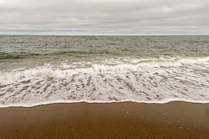 Ocean waves reaching sandy shore, a Nature Photo by Elena Vagengeim