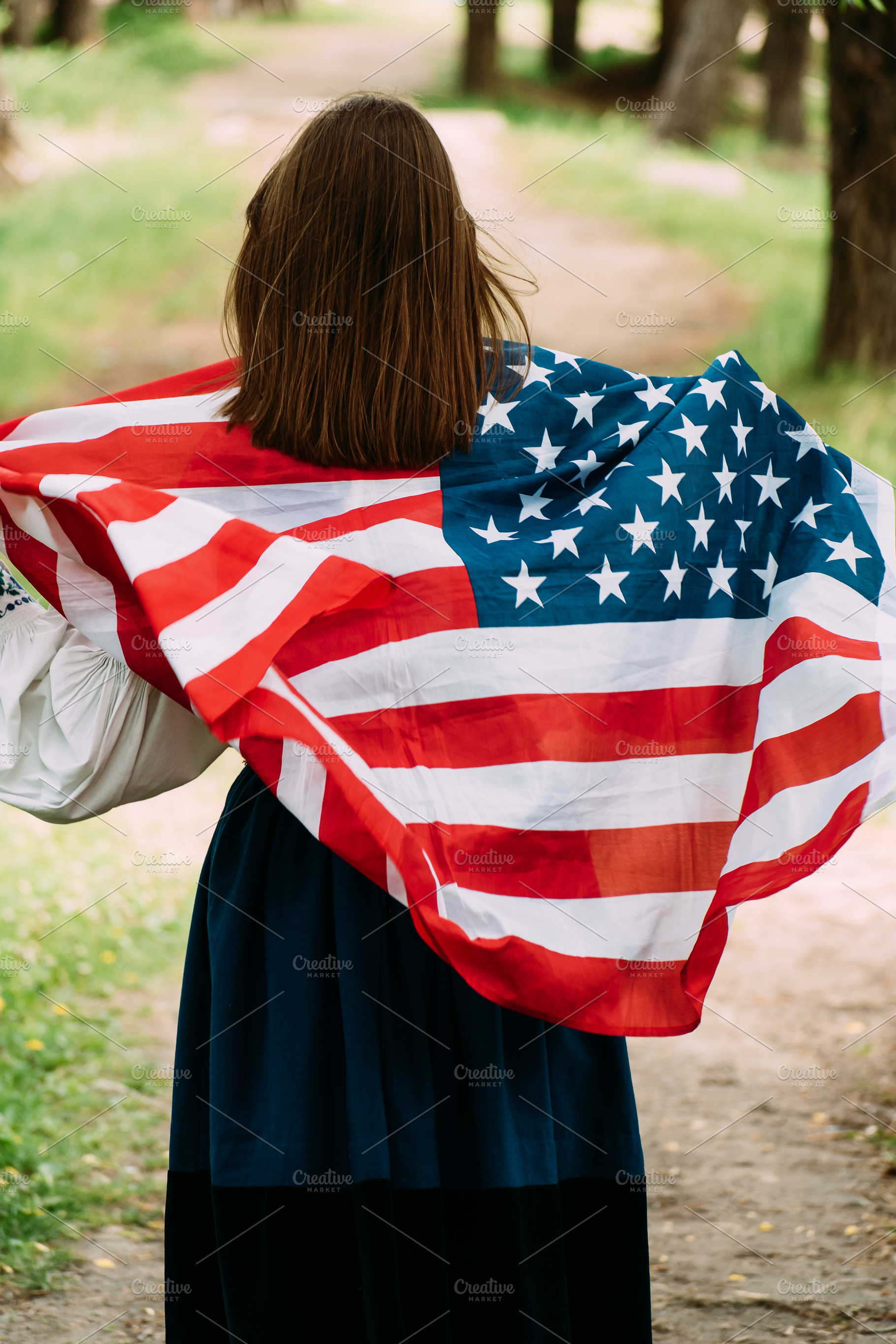Woman posing with USA national flag, a Person Photo by Oleksandr Masnyi